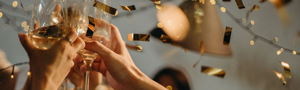 raising glasses for a toast during a holiday party