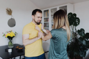 A man being abused by a woman