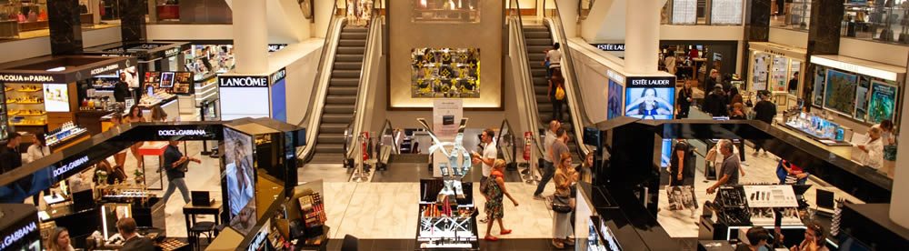 mall department store with people walking back and forth, unaware of being watched