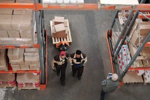 employees moving inventory in a warehouse