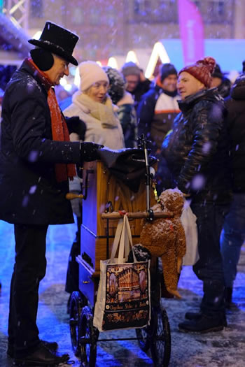 a man selling something on a winter day